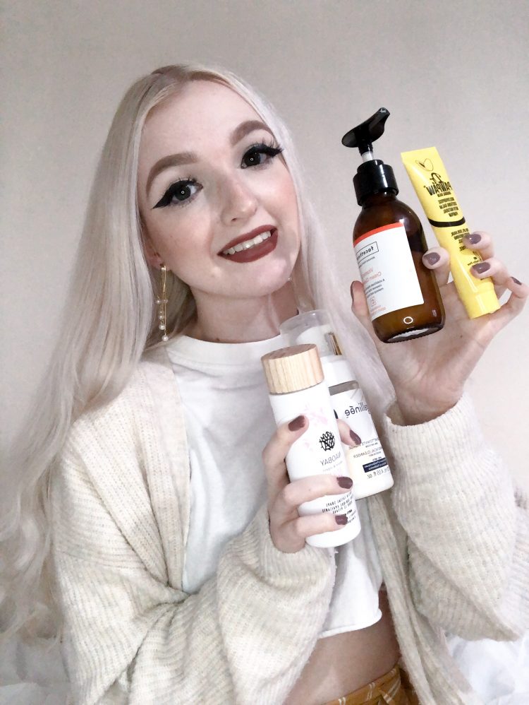Flossie holding various skincare products